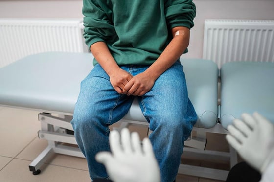 man sitting on a medical table