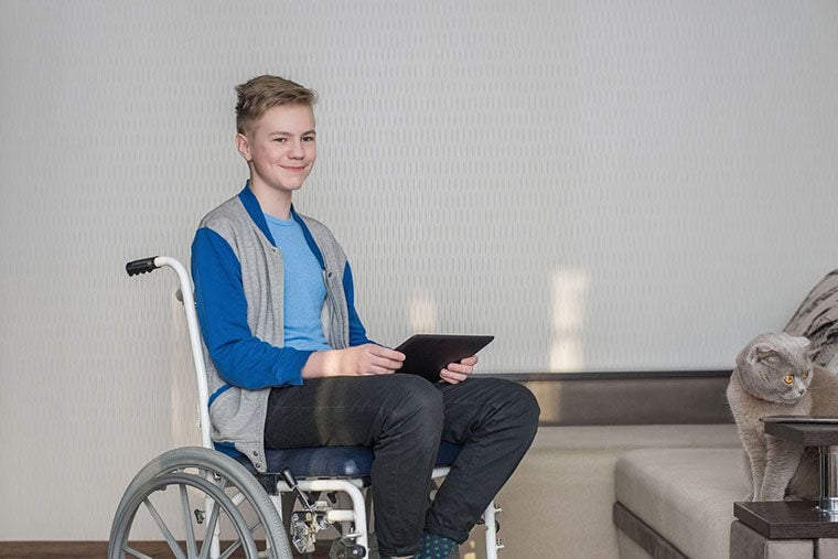 smiling-teenager-in-wheelchair