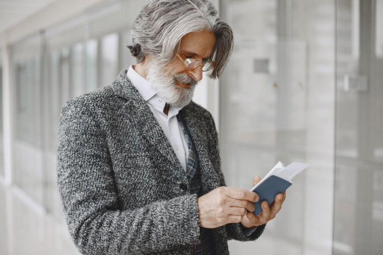 man looking at his checkbook