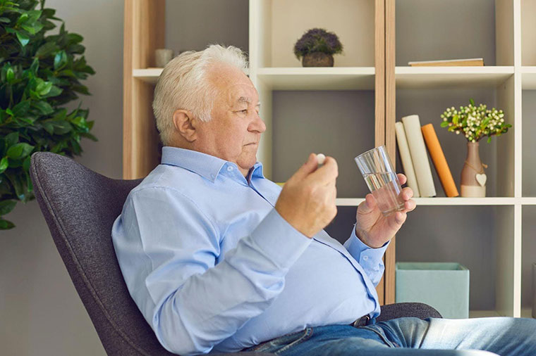 man taking medicine